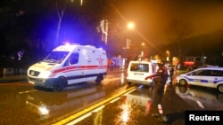 An ambulance arrives near a nightclub where a gun attack took place during a New Year's party in Istanbul, Turkey, Jan. 1, 2017. 