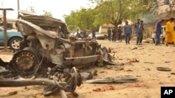 Hiện trường sau vụ nổ bom ở Kano, Nigeria, ngày 19/5/2014.