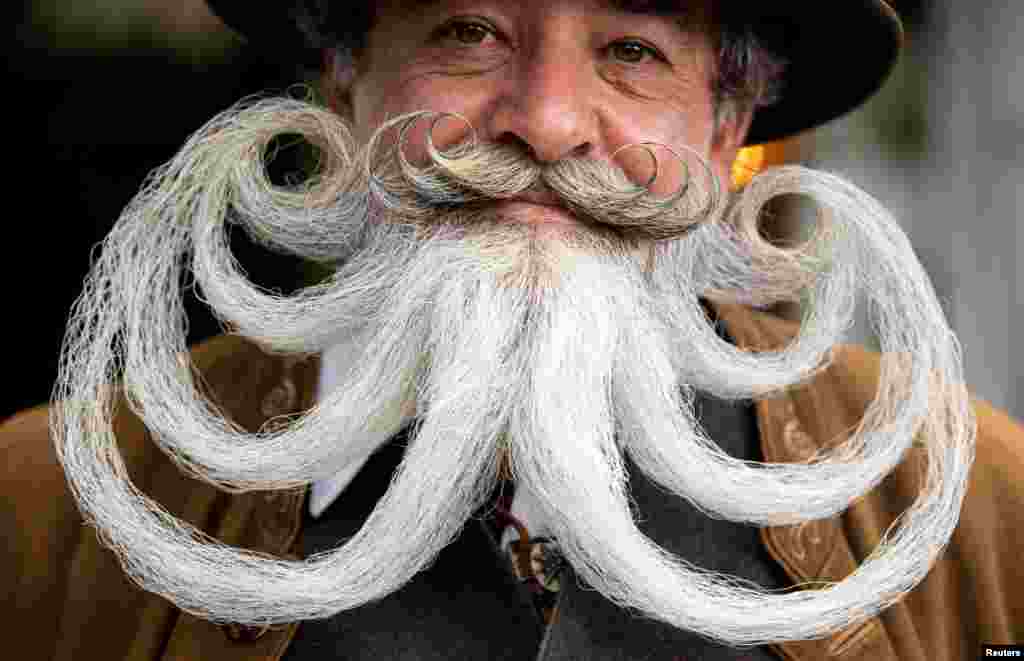 Norbert Dopf from Austria participates in the German Moustache and Beard Championships 2021 at Pullman City Western Theme Park in Eging am See, Germany, Oct. 23, 2021.