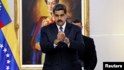 Venezuela's President Nicolas Maduro greets the international observers for the May 20 election at the presidential palace in Caracas, May 18, 2018. 