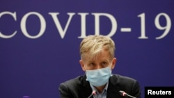 Ông Bruce Aylward thuộc Tổ chức Y tế Thế giới (WHO) dự cuộc họp báo do phái đoàn chung của WHO-Trung Quốc điều tra về virus corona bùng phát, tổ chức ngày 24/2/2020 tại Bắc Kinh.