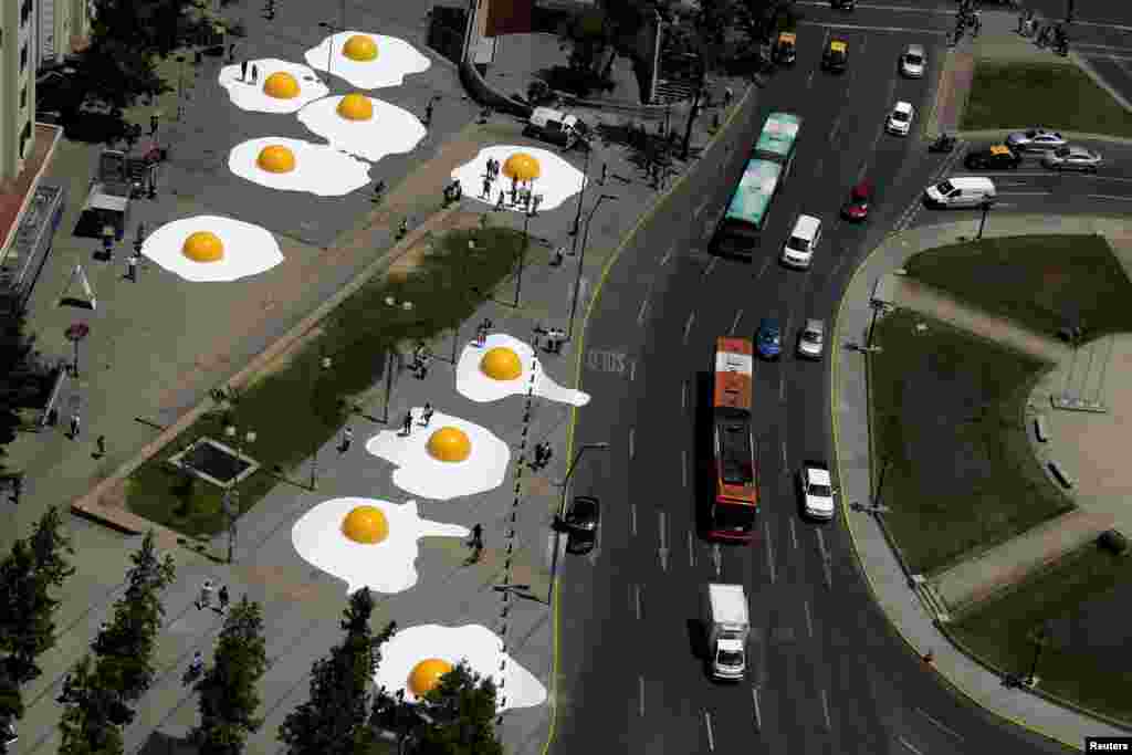 Giant fried eggs art installation are seen as part of &quot;Hecho en Casa&quot; (Made at home) urban artwork festival in downtown Santiago, Chile, Nov. 8, 2016.
