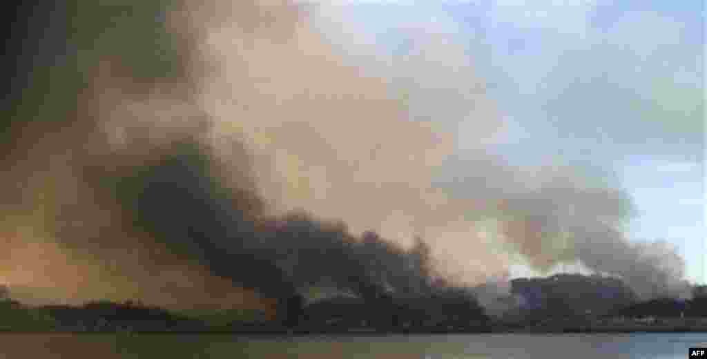 Smoke billow from Yeonpyeong island near the border against North Korea, in South Korea, Tuesday, Nov. 23, 2010. North Korea bombarded the South Korean island near their disputed western border Tuesday, setting buildings ablaze and killing at least one ma