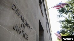 FILE - The exterior of the U.S. Department of Justice headquarters building in Washington, July 14, 2009.