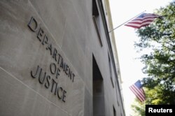 FILE - The exterior of the U.S. Department of Justice headquarters building is shown in Washington, July 14, 2009.