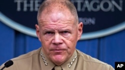Marine Corps Commandant Gen. Robert Neller pauses during a news conference at the Pentagon, March 10, 2017. 