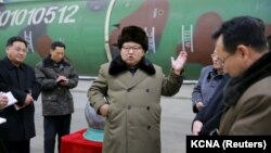FILE - North Korean leader Kim Jong Un (C) meets with scientists and technicians involved in the country's nuclear weapons program, in this undated photo released by North Korea's Korean Central News Agency (KCNA), in Pyongyang, March 9, 2016.