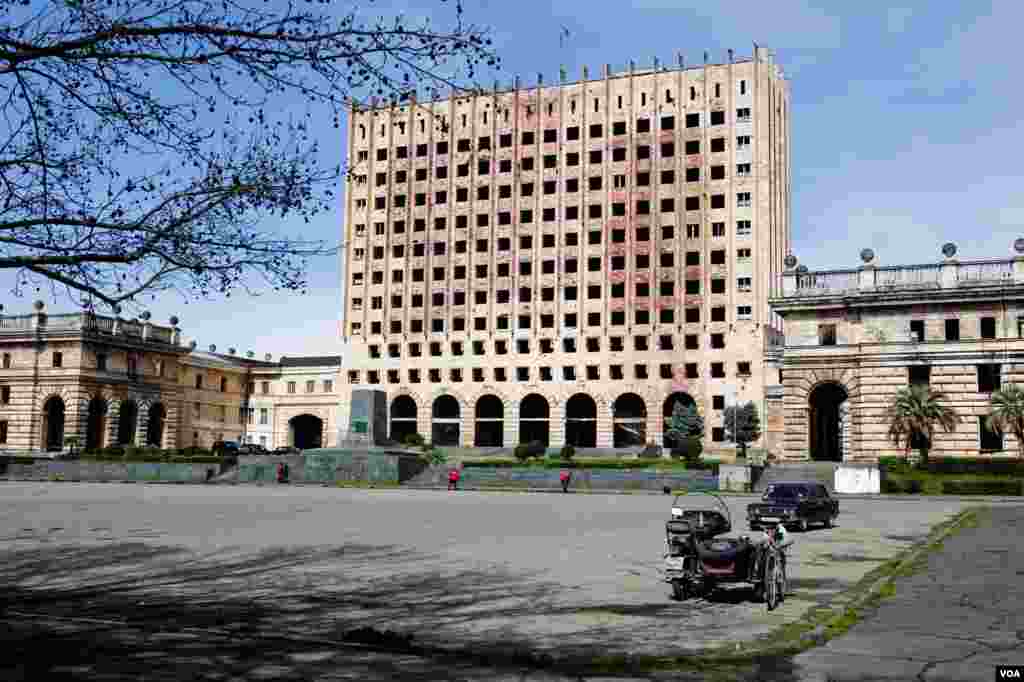 Looming over Freedom Square in Sukhumi stands the bombed out ruin of the Georgian military’s last headquarters, untouched since they lost control of Abkhazia in the summer of 1993. (V. Undritz/VOA)