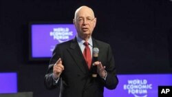 WEF founder, Klaus Schwab opens a session of the "Social Forum" at the World Economic Forum in Davos, Switzerland, 25 Jan 2011