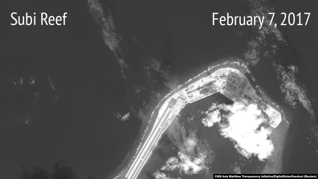 A satellite image shows what CSIS Asia Maritime Transparency Initiative says appears to be concrete structures with retractable roofs on the artificial island Fiery Cross reefs, South China Sea, in this image released on February 22, 2017.