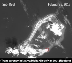 A satellite image shows what CSIS Asia Maritime Transparency Initiative says appears to be concrete structures with retractable roofs on the artificial island Fiery Cross reefs, South China Sea, in this image released on February 22, 2017.
