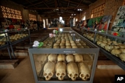 Skulls of some of those who were slaughtered as they sought refuge in the church sit in glass cases, kept as a memorial to the thousands who were killed in the 1994 genocide in Rwanda.