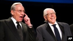 FILE - Bob Woodward, left, and Carl Bernstein appear at the White House Correspondents' Dinner in Washington, April 29, 2017. 