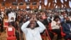 L'ancien président ivoirien Laurent Gbagbo (C) fait des gestes lors de la clôture du congrès constituant de son nouveau parti le Parti des Peuples Africains-Côte d'Ivoire (PPA-CI) à l'Hôtel Ivoire à Abidjan, en octobre 17 février 2021. (Photo Sia KAMBOU / AFP)