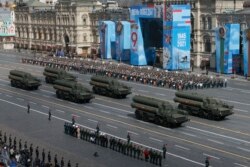 FILE - Russian S-400 Triumf surface-to-air missile systems roll during a dress rehearsal for the Victory Day military parade in Red Square in Moscow, Russia, Friday, May 7, 2021.