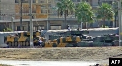 Turkish tanks arrive at the Iskenderun train port, Oct. 7, 2017. at Iskenderun district in Turkey's Hatay province. Turkish President Recep Tayyip Erdogan said Saturday that pro-Ankara Syrian rebels were staging a new military operation in Syria's jihadist-controlled Idlib province.