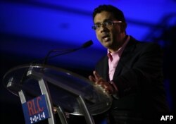 FILES) In this file photo taken on May 31, 2014 conservative filmmaker and author Dinesh D'Souza speaks during the final day of the 2014 Republican Leadership Conference in New Orleans, Louisiana.