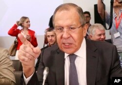 FILE - Russian Foreign Minister Sergey Lavrov talks to journalists before an informal ministerial meeting of the Organization for Security and Cooperation in Europe, OSCE, in Mauerbach near Vienna, Austria, July 11, 2017.
