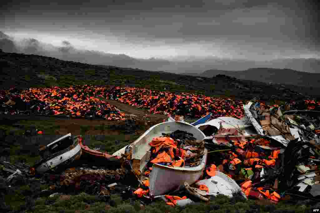 Wrecked boats and thousands of life jackets used by refugees and migrants during their journey across the Aegean sea lie in a dump in Mithimna, Greece. The EU and Turkey will hold a special summit in early March to push forward a deal to stem the migration crisis.