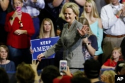 Sen. Cindy Hyde-Smith, R-Miss., walks on to the stage after being introduced by President Donald Trump at a rally on Oct. 2, 2018, in Southaven, Mississippi.