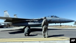 FILE - A U.S. F-15C Eagle jet fighter prepares for takeoff during a Lithuanian-NATO air force exercise at the Siauliai airbase, 144 miles east of Vilnius, Lithuania, April 1, 2014. Seven F-15Cs landed at Siauliai this week to patrol skies over the Baltic countries. 