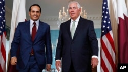 FILE - Secretary of State Rex Tillerson (right) meets with ‎Qatari Foreign Minister Sheikh Mohammed bin Abdulrahman Al Thani, June 27, 2017, at the State Department in Washington.