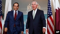 Secretary of State Rex Tillerson (right) meets with ‎Qatari Foreign Minister Sheikh Mohammed bin Abdulrahman Al Thani, June 27, 2017, at the State Department in Washington.