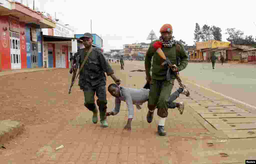 Congolese soldiers arrest a civilian protesting against the government&#39;s failure to stop the killings and inter-ethnic tensions in the town of Butembo, in North Kivu province, Democratic Republic of Congo.