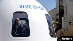 FILE - Amazon and Blue Origin founder Jeff Bezos addresses the media about the New Shepard rocket booster in Colorado Springs, Colorado, April 5, 2017. 