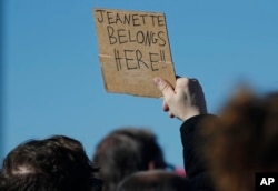 FILE - A supporter holds up a placard during a rally in support of Jeanette Vizguerra, a Mexican woman seeking to avoid deportation from the United States, outside the Immigration and Customs Enforcement office in Centennial, Colorado, Feb. 15, 2017.