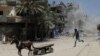 Smoke rises during what witnesses said was an explosion caused by an Israeli air strike on a house in Gaza City, Aug. 23, 2014. 