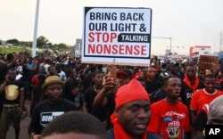 FILE - People protest power cuts in Accra, Ghana, May 16, 2015.