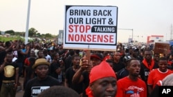 FILE - People are seen protesting against power cuts in Accra, Ghana, May 16, 2015.