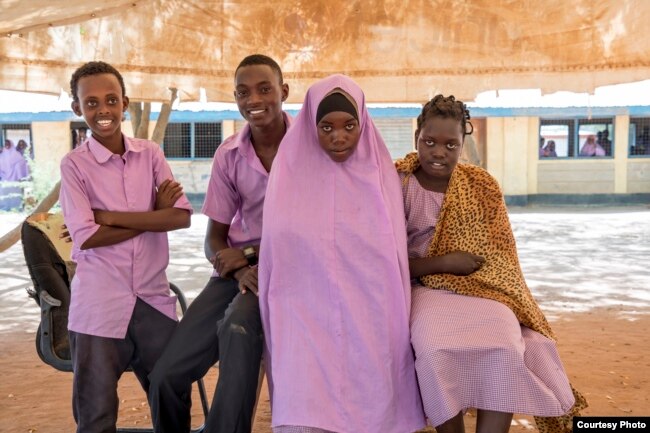 From left, Feisal Saney Zuber, Elisa Elisama Mangu, Safiyo Noor Hassan and Stella Poni Vuni are students at Illeys Elementary School who wrote letters to fifth grade students at Valley Peaks Elementary School in Boulder, Colorado. (Carey Wagner/CARE)