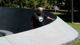 Cauline Yates, descendant of one of Thomas Jefferson's slave mistresses, looks over names inscribed in the walls of the Memorial to Enslaved Laborers at the University of Virginia in Charlottesville, Va., Thursday, May 6, 2021. (AP Photo/Steve Helber)
