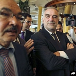 International Criminal Court (ICC) Chief Prosecutor Luis Moreno-Ocampo (C) visits Tripoli November 22, 2011