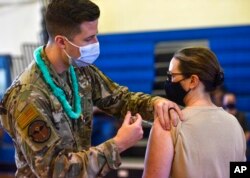 FILE - Hickam 15th Medical Group host the first COVID-19 mass vaccination on Joint Base Pearl Harbor-Hickam, in this Feb. 9, 2021, photo provided by the Department of Defense.