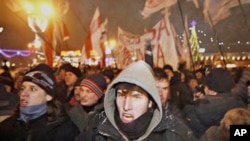 Protesters rally as they denounce the Belarus presidential election saying it was falsified in the capital, Minsk, 19 Dec 2010