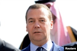 Russian Prime Minister Dmitry Medvedev is seen in a group photo during the second day of the international conference on Libya in Palermo, Italy, Nov. 13, 2018.