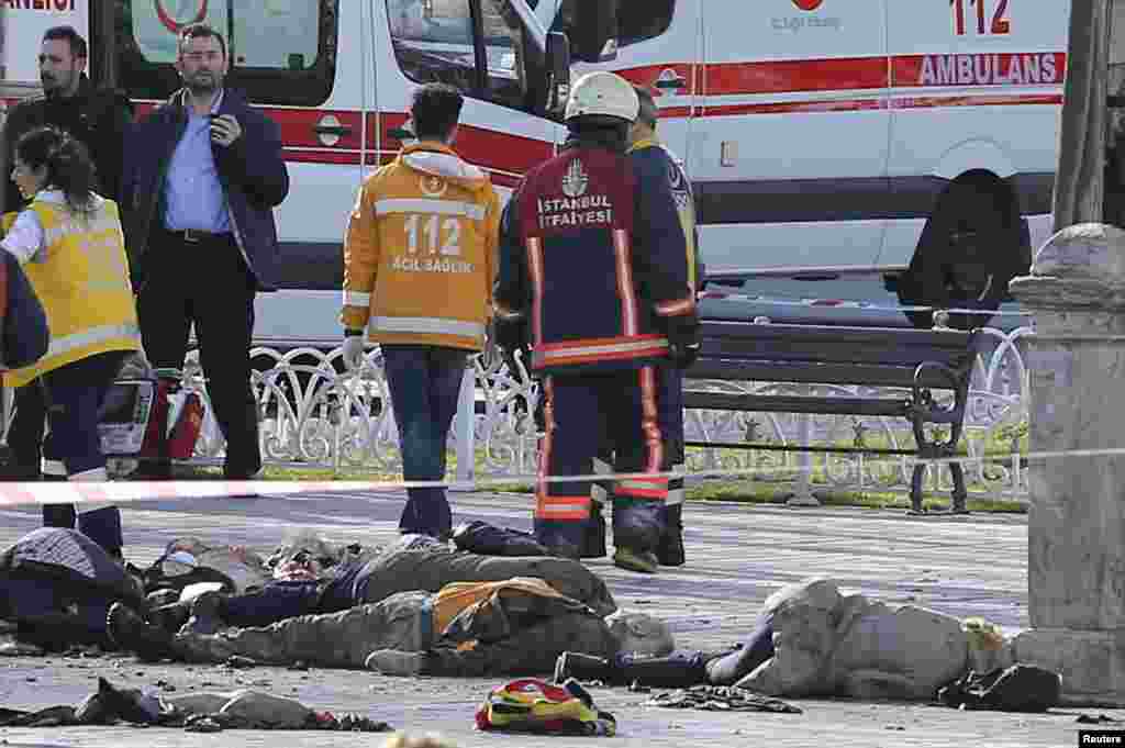 Rescue teams gather at the scene next to bodies after an explosion in the heart of Istanbul&#39;s historic Sultanahmet tourist district, in central Istanbul, Jan. 12, 2016.