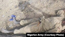 A Boko Haram fighter lies dead after an attack on Dikwa, Borno State, Nigeria, February 24, 2016.