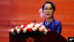Myanmar's leader Aung San Suu Kyi speaks during the signing ceremony of "Nationwide Ceasefire Agreement" at Myanmar International Convention Center in Naypyitaw, Myanmar, Feb. 13, 2018.