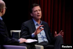 Former FBI director James Comey speaks about his book during an onstage interview with Axios Executive Editor Mike Allen at George Washington University in Washington, April 30, 2018.