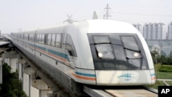 In this file photo, a maglev train runs in this Sept. 25, 2006 file photo in Shanghai, China. (AP Photo/Eugene Hoshiko, File)