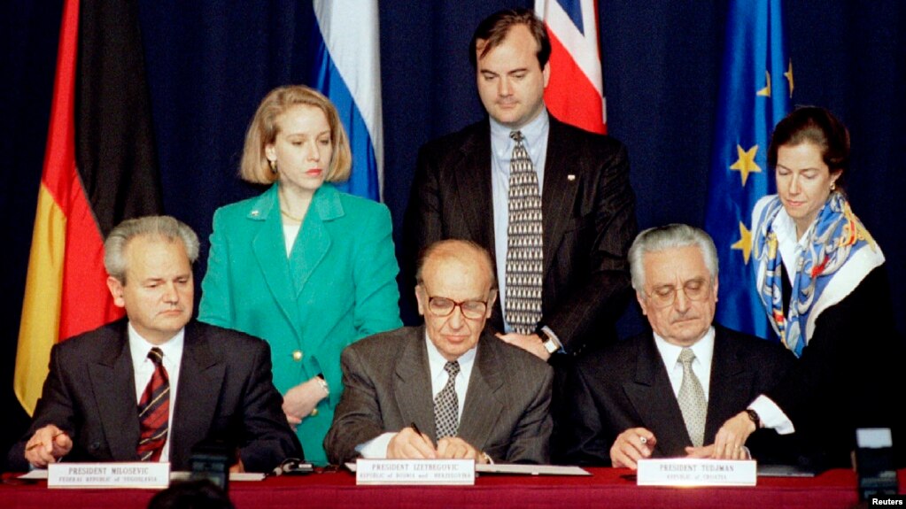 President Slobodan Milosevic of Serbia (L), President Alija Izetbegovic of Bosnia-Herzegovina (C) and President Franjo Tudjman of Croatia sign the Dayton Agreement peace accord at the Hope Hotel inside Wright-Patterson Air Force Base in this November 21, 