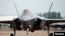 FILE - A Lockheed Martin F-35A fighter taxis along a runway at the Royal International Air Tattoo at Fairford, England, July 8, 2016. 