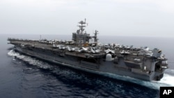 FILE - A general view shows the nuclear-powered aircraft carrier USS Harry S. Truman at an undisclosed position in the Mediterranean Sea.