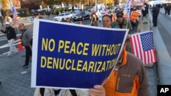 Protesters march toward the U.S. Embassy during a rally supporting the United States' policy to put steady pressure on North Korea in Seoul, South Korea, Nov. 3, 2018.