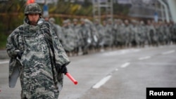 FILE - South Korean marines march during a military exercise as a part of the annual joint military training called Foal Eagle between South Korea and the U.S. in Pohang, South Korea, April 5, 2018. 