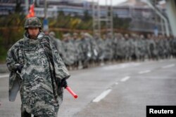 FILE - South Korean marines march during a military exercise as a part of the annual joint military training called Foal Eagle between South Korea and the U.S. in Pohang, South Korea, April 5, 2018.